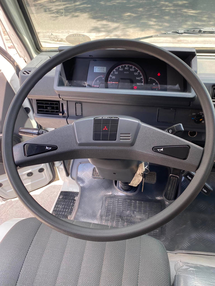 2025 MITSUBISHI	L300 2.2L DSL WITH FB BODY AND DUAL AC MANUAL TRANSMISSION