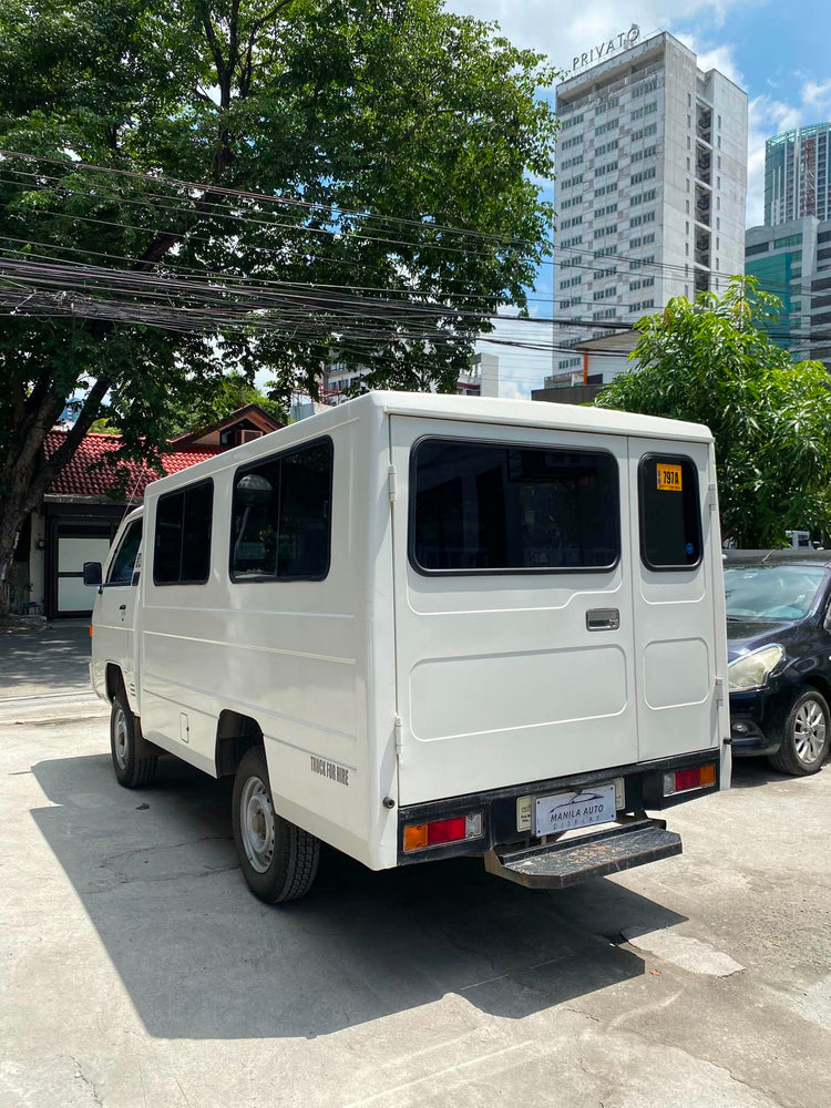 2025 MITSUBISHI	L300 2.2L DSL WITH FB BODY AND DUAL AC MANUAL TRANSMISSION